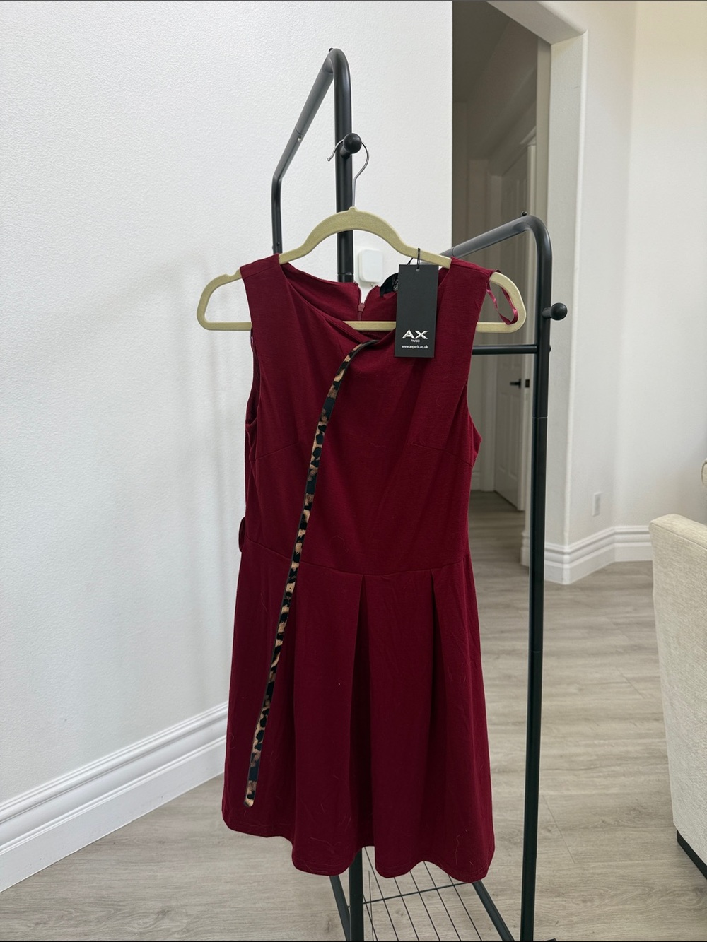 AX Paris woman’s dress with leopard belt